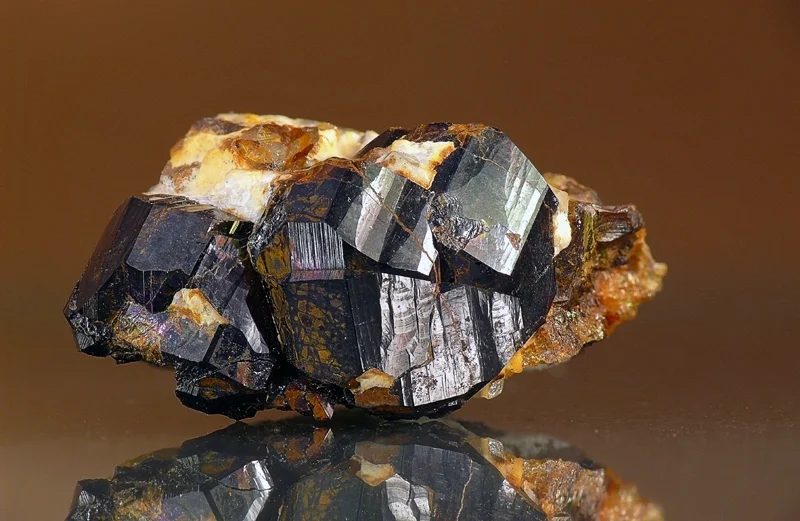 Fotografie minerálu Kassiterit z lokality Krupka, štola 7. spáčů, Czech Republic